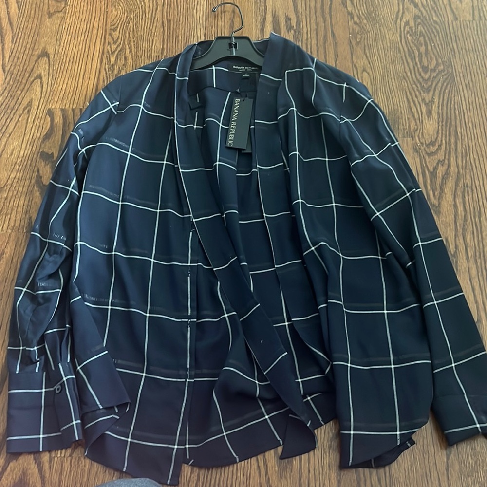 Black checkered long sleeve button down blouse with tie at the top